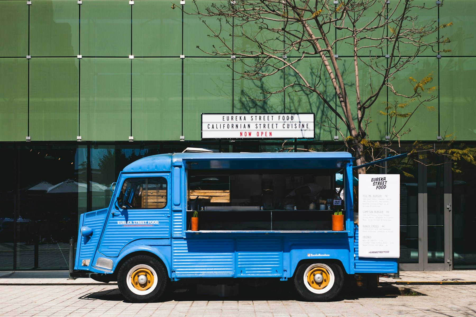 A food truck parked up with the hatch open